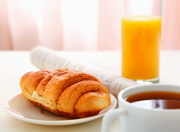 Croissants, Coffee,  Juice and Newspapers