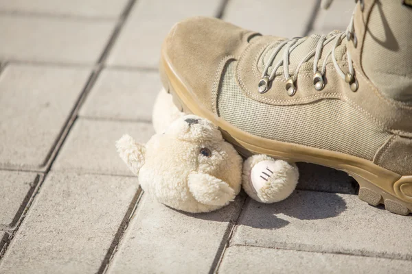 Military man set foot on a toy