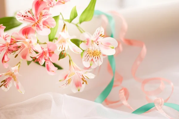 Summer wedding celebration. Wedding flowers and wedding rings newlyweds. Beautifully decorated with flowers.