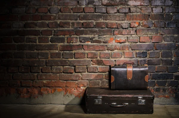 Retro bags on brick wall background