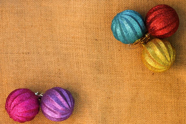 Christmas decorations balls on background sacks