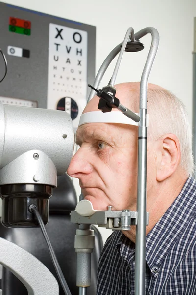 Older man having eye examination