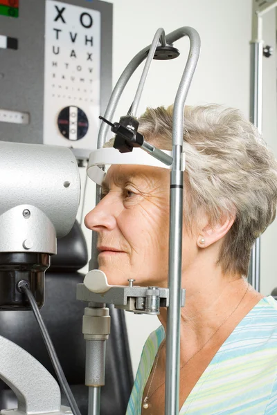 Lady having eye test examination