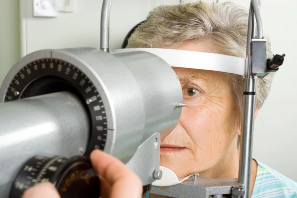 Lady having eye test examination