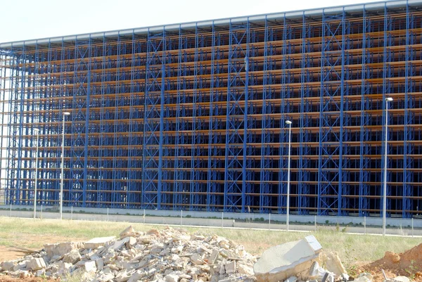 Empty warehouse, factory shell under construction.