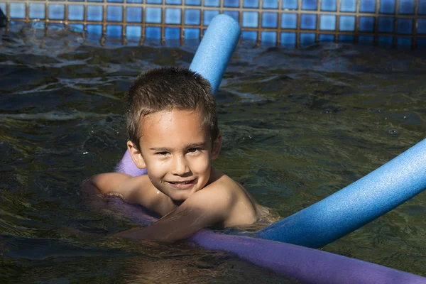 Little boy in swimming pool