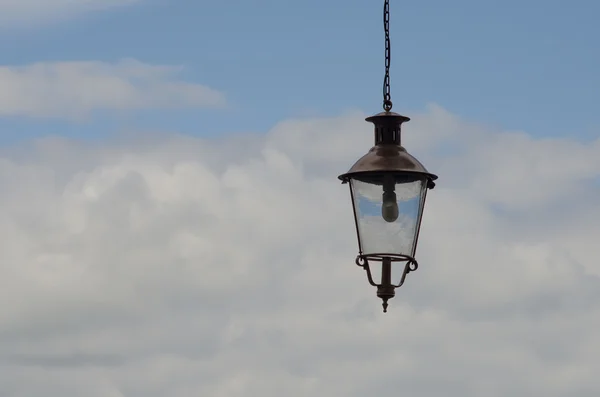 Decorative lantern against the sky with clouds