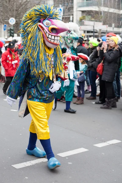Person wearing carnival costume and walking in carnival parade