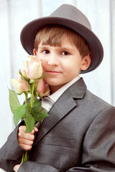 Boy holds flowers