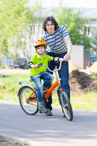 Father and son with bicycle