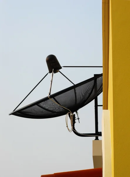 Satellite antenna on a house facade