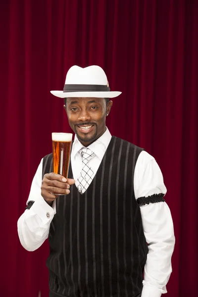 African american bartender in retro suit with beer