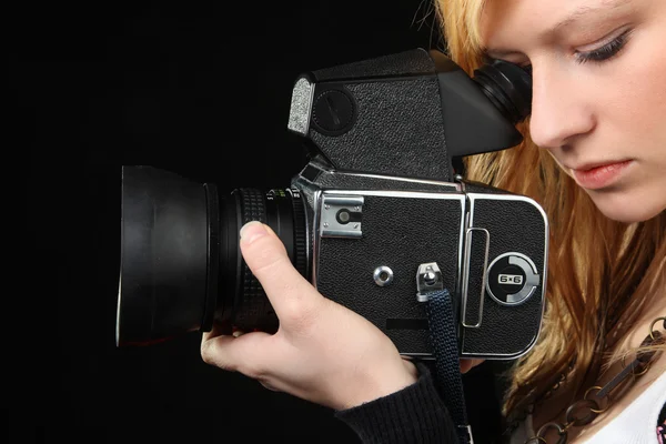 Blonde girl photographing