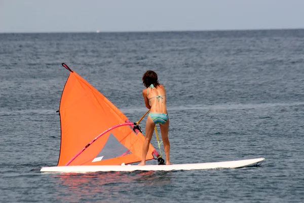 Girl learning to surf