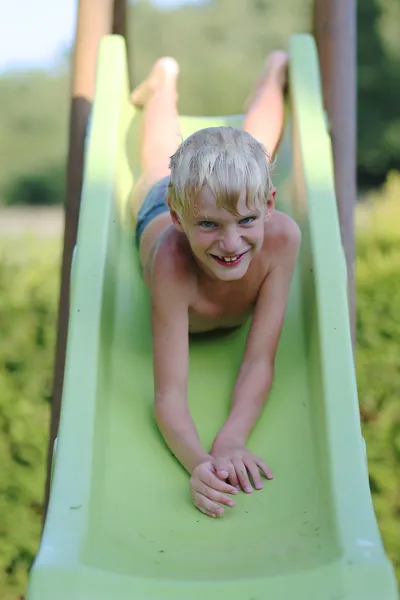 Boy playing outdoors in playground