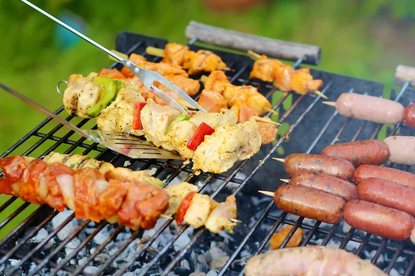 Assorted meat and vegetables on barbecue grill