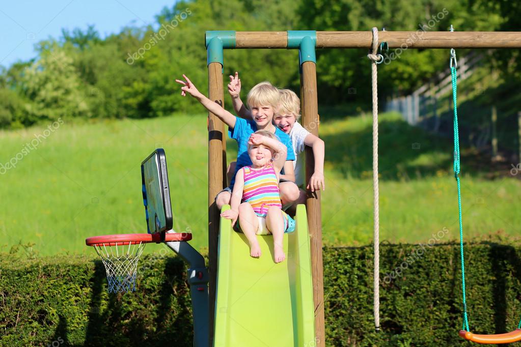 Happy kids having fun on the playground — Stock Photo © CroMary #47408075