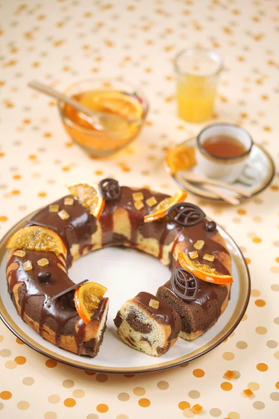 Marble Cake with chocolate glaze and caramelized orange slices