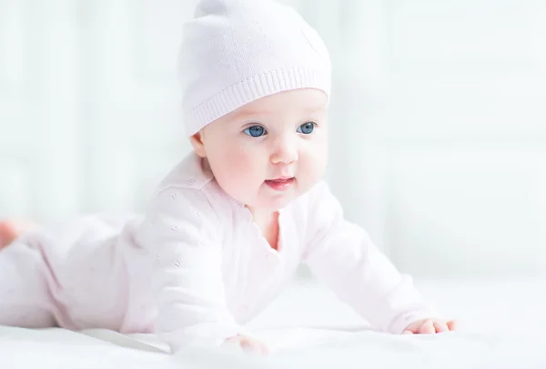Baby girl in pink knitted hat