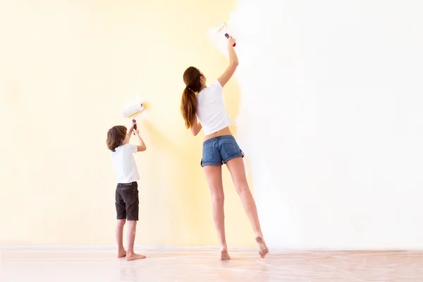 Mother and son paiting walls