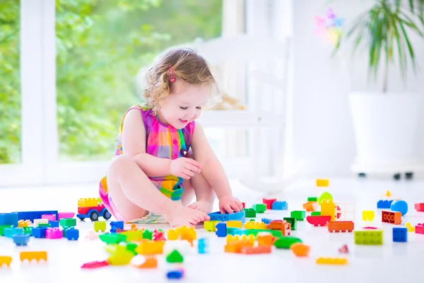 Little girl playing with blocks