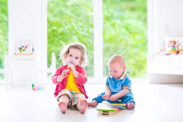 Kids playing music with xylophone