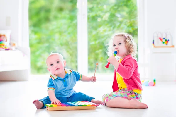 Kids playing music with xylophone