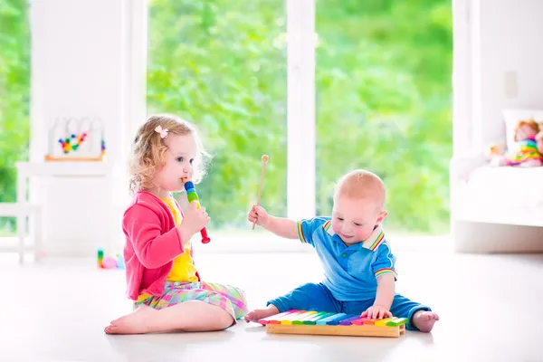 Kids playing music with xylophone