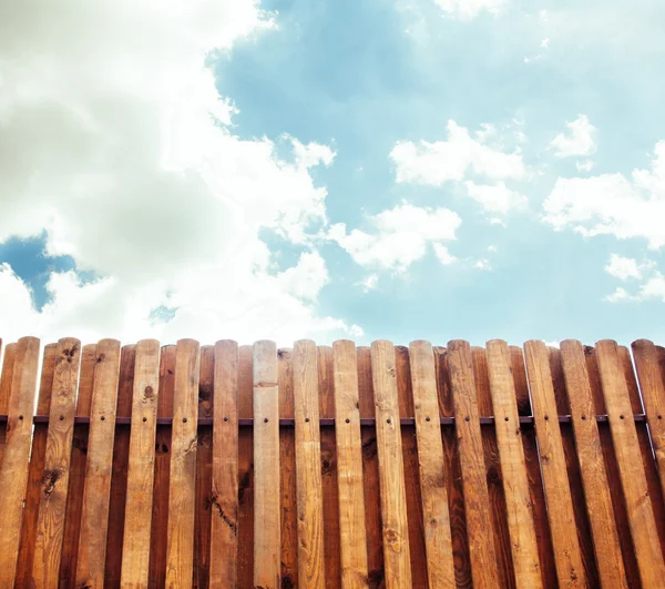 Old wooden fence with gate on sky background - rendering