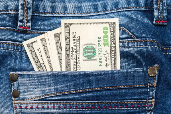 Paper money in the pocket of jeans. close-up