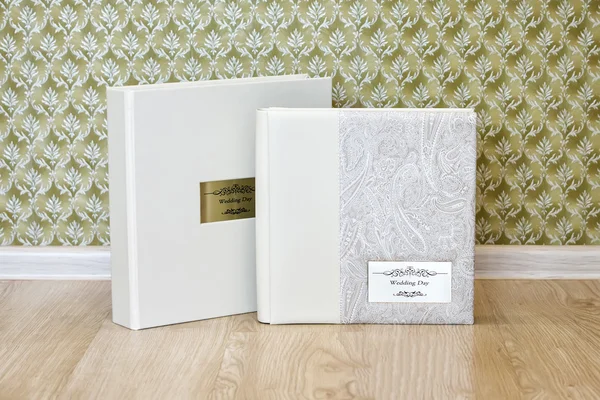 Wedding photo book with leather combined cover and metal shield.