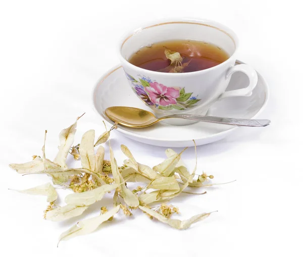Linden tea with linden flowers on a white background