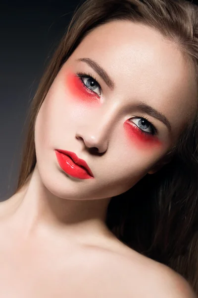 Beautiful girl with bright make-up creative