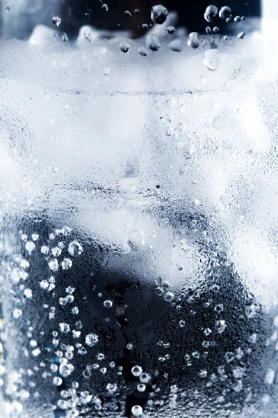 Ice and water in cup - closeup