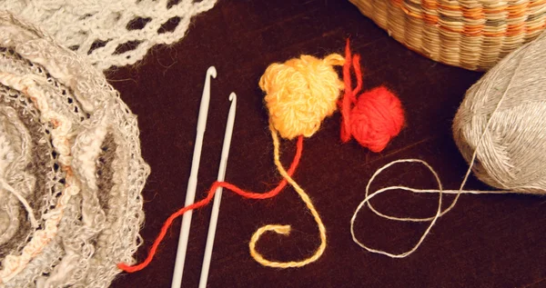 Knitting, needlework, hooks, balls of yarn, macrame