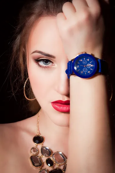 Beautiful young girl with wrist watch