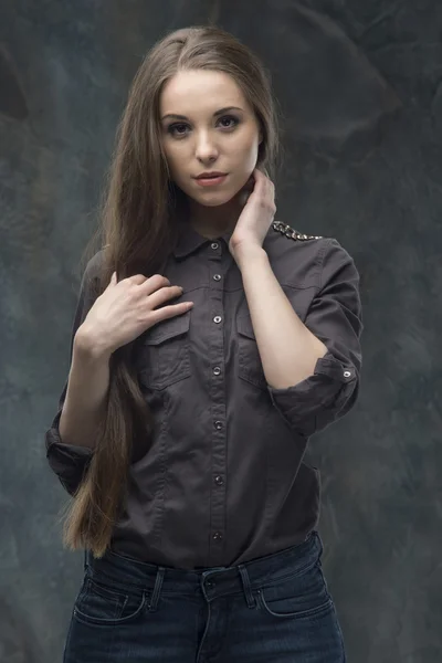 Woman half length on dark background