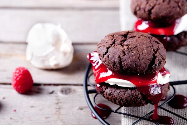 Chocolate cookie with jam and meringue