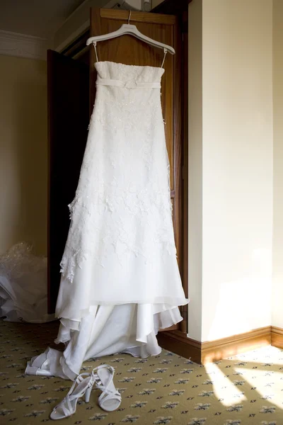 The dress of the flower girl before the wedding in the room