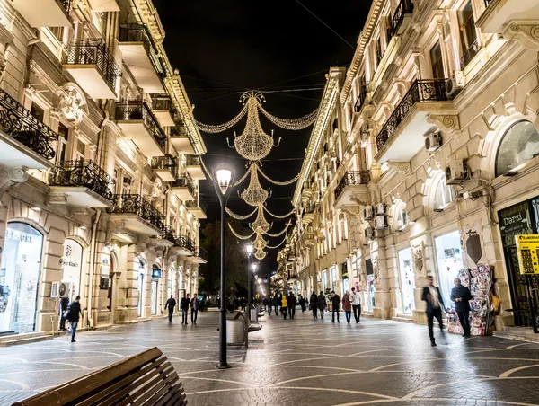 BAKU, AZERBAIJAN - NOVEMBER 22: Nizami street in the center of Baku, Azarbaijan, illuminated by night on the November 22, 2013. The street is known for its exclusive stores and restaurants