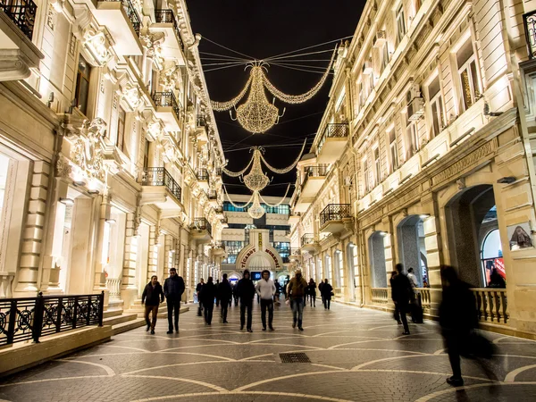 BAKU, AZERBAIJAN - NOVEMBER 22: Nizami street in the center of Baku, Azarbaijan, illuminated by night on the November 22, 2013. The street is known for its exclusive stores and restaurants