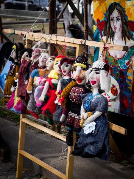 TBILISI, GEORGIA - MARCH 24: Traditional dolls on the Dry Bridge Market in downtown of Tbilisi on March 24, 2013. The Market is the city\'s unofficial open-air art and second-hand bazaar
