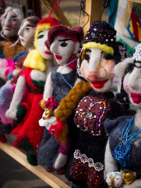 TBILISI, GEORGIA - MARCH 24: Traditional dolls on the Dry Bridge Market in downtown of Tbilisi on March 24, 2013. The Market is the city\'s unofficial open-air art and second-hand bazaar
