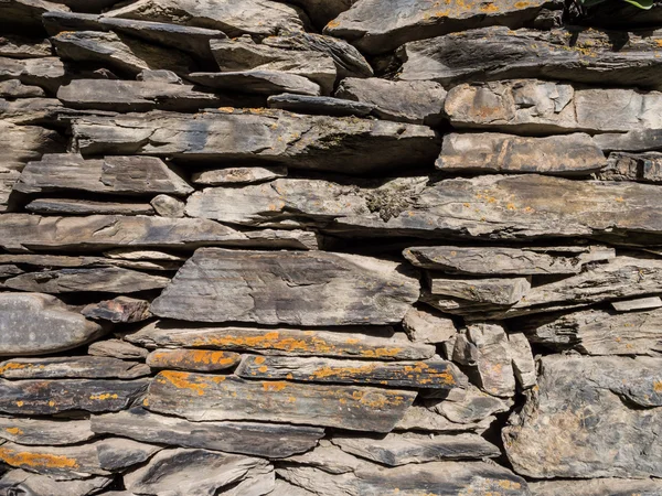 Wall built from shale stones, typical built material in Tusheti, Georgia.