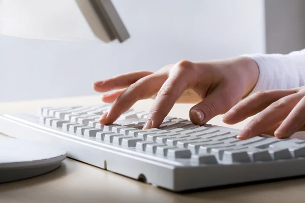 Hands touching keyboard