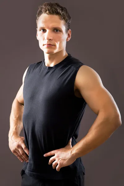 Fitness man on a gray background