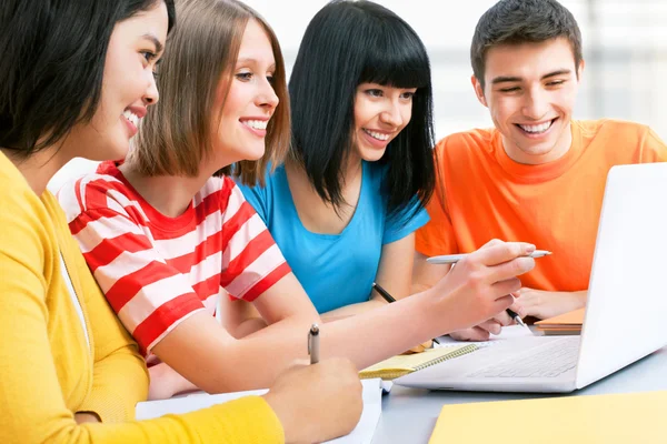 Students studying with laptop