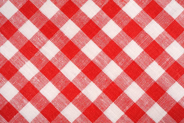 Red and white plaid fabric. Linen red checkered. Background and texture.