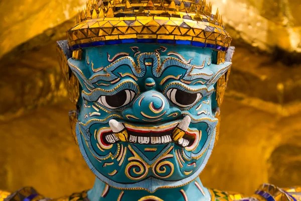 Close up face of Yak statue at the phra keaw