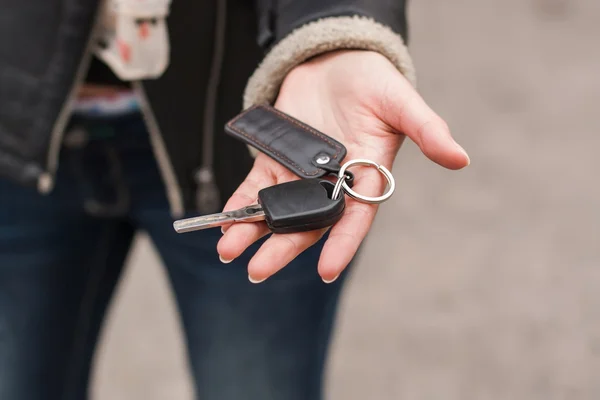 Transfer of car keys in female handsl